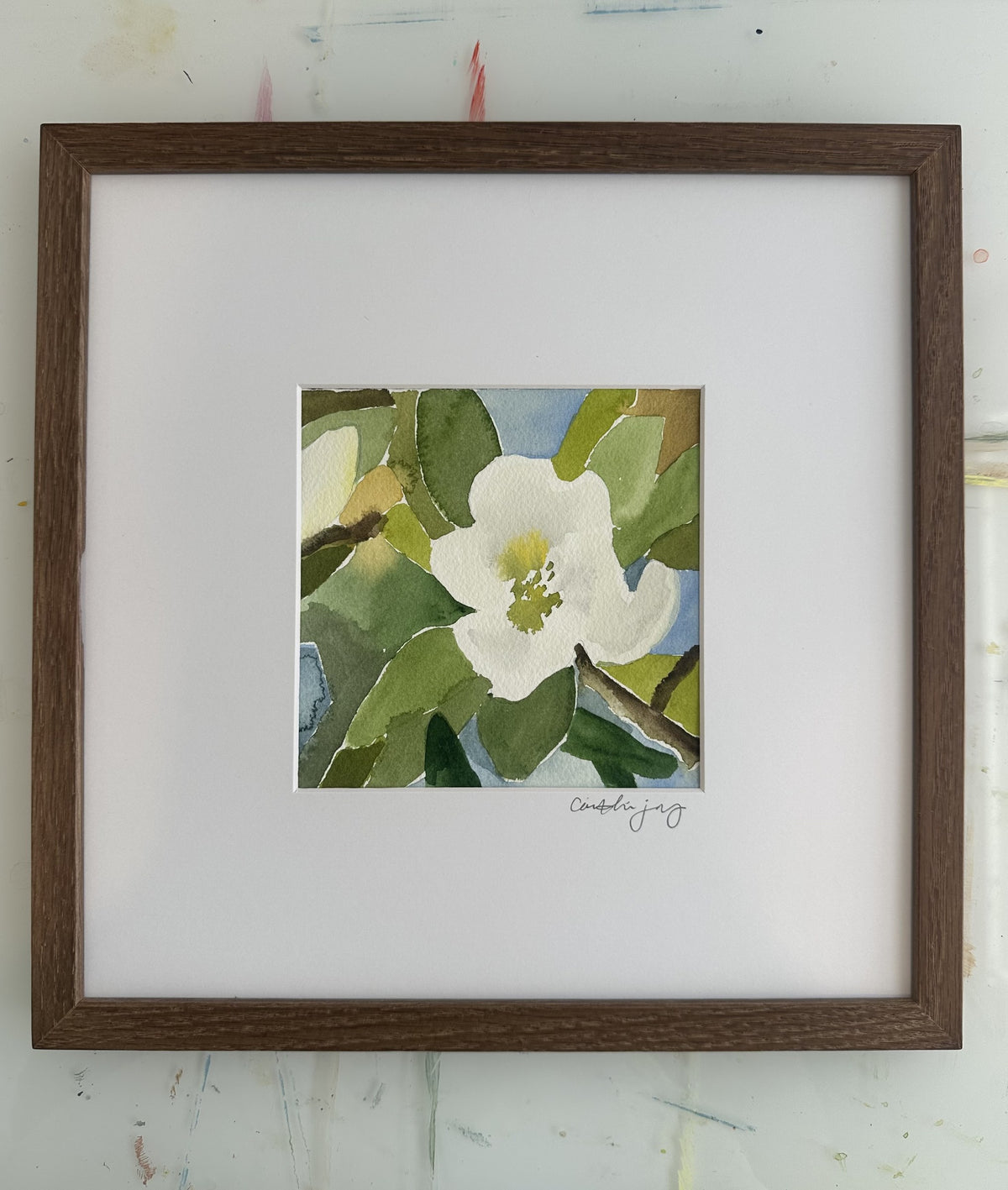 Magnolia No. 3 - framed original watercolour on the studio desk