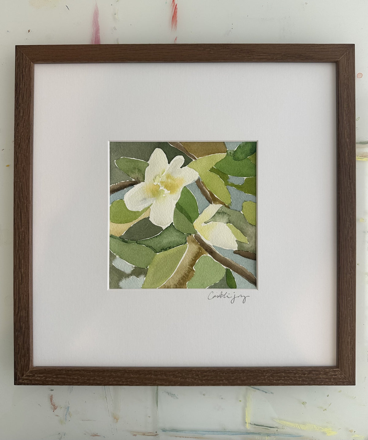 Magnolia No. 4 - framed original watercolour on the studio desk