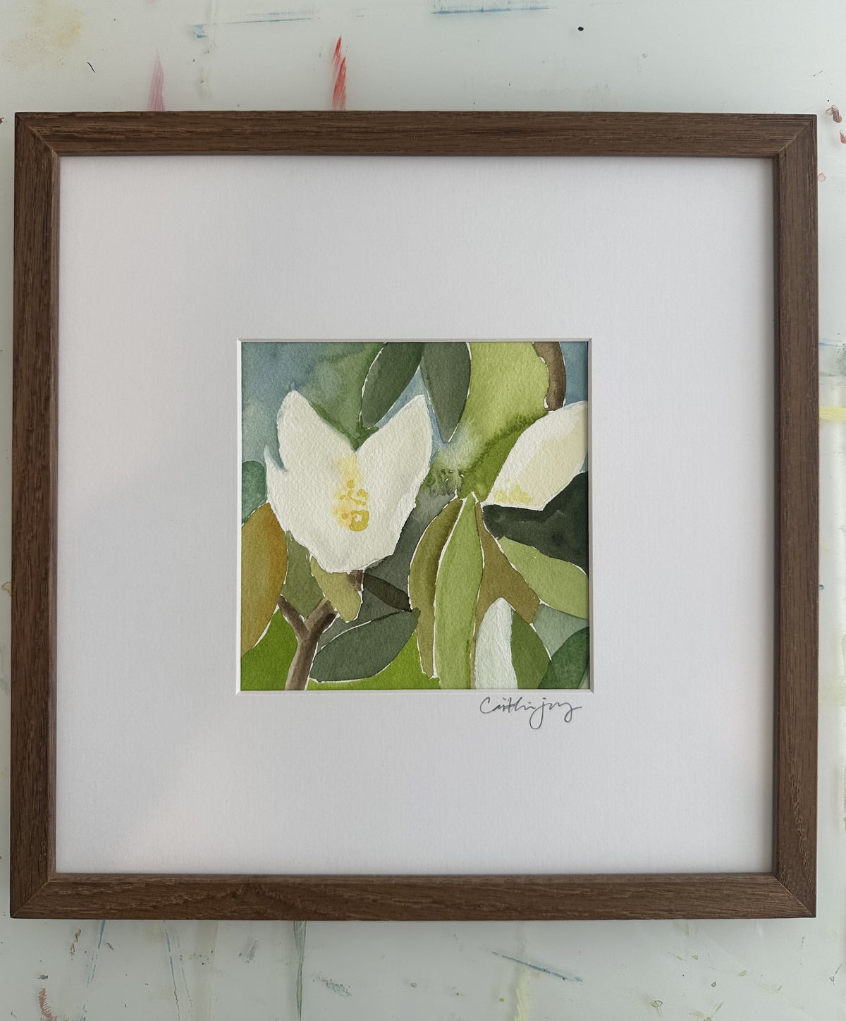 Magnolia No. 5 - framed original watercolour on the studio desk