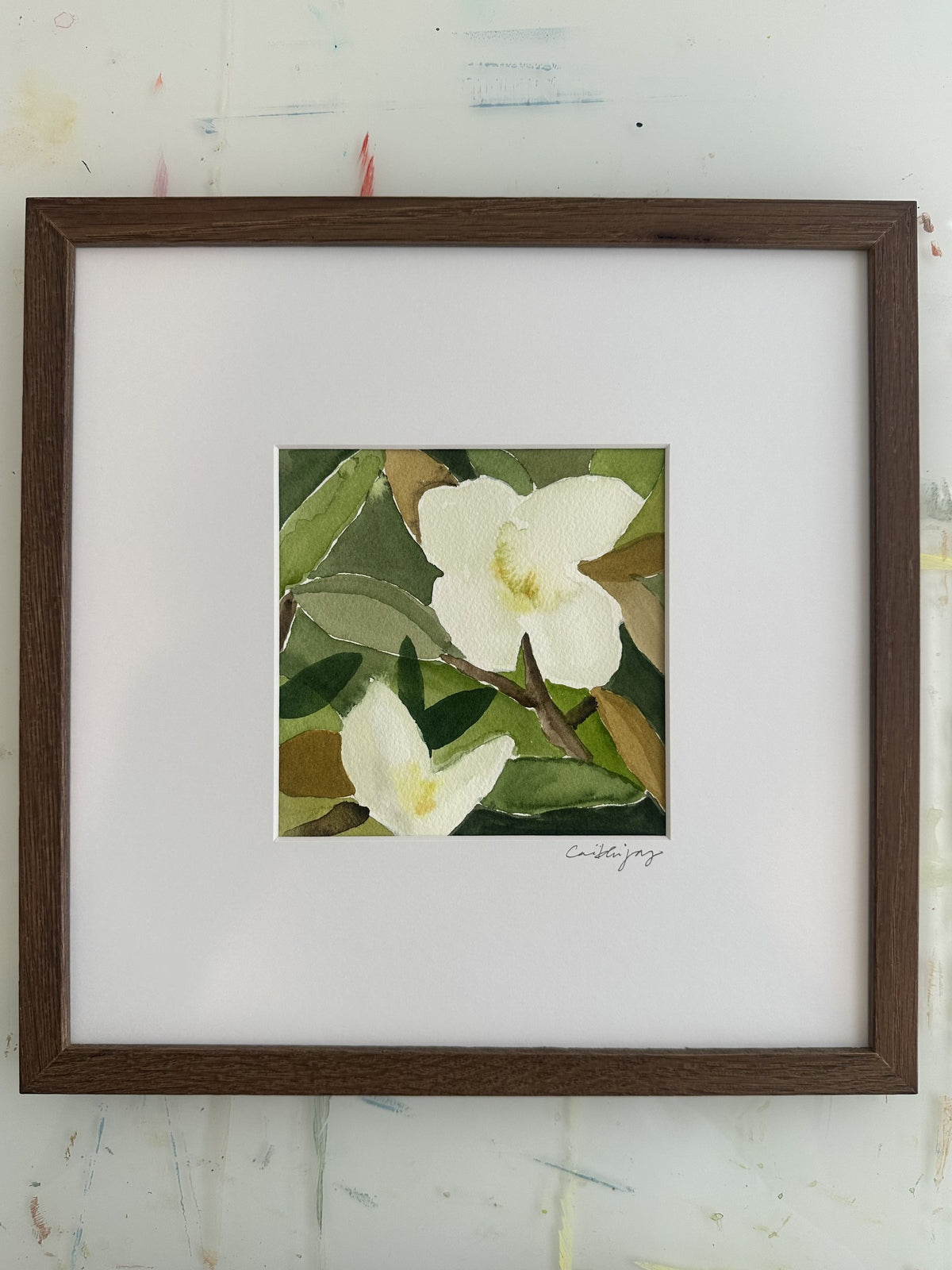 Magnolia No. 6 - framed original watercolour on the studio desk