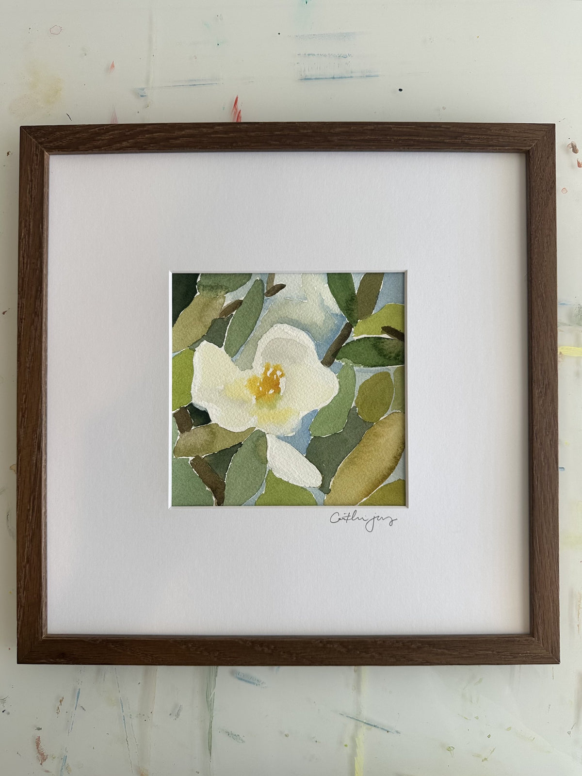 Magnolia No. 7 - framed original watercolour on the studio desk