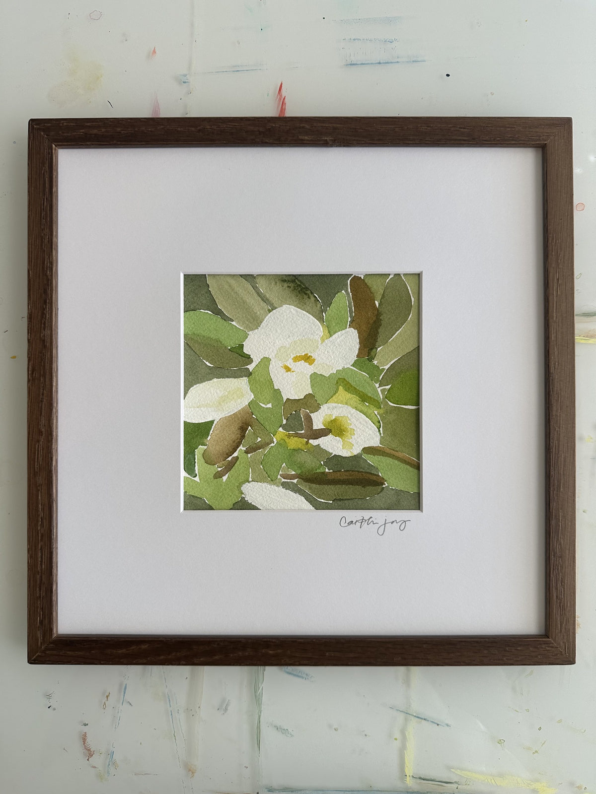 Magnolia No. 8 - framed original watercolour on the studio desk